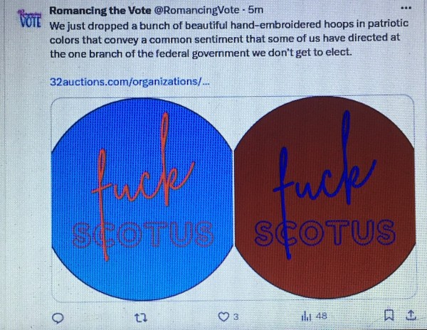 Tweet by the Romancing the Vote account:
We just dropped a bunch of beautiful hand embroidered hoops in patriotic colors that convey a common sentiment that some of us have directed at the one branch of the federal government we don't get to elect.

with an image of "FUCK SCOTUS" embroidered on contrasting bright colors.