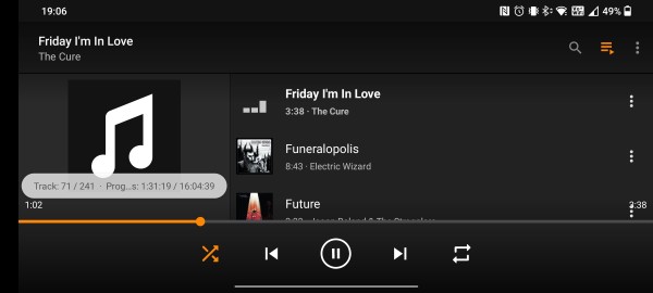 Landscape screenshot of VLC for Android showing Friday I'm in Love by The Cure playing.